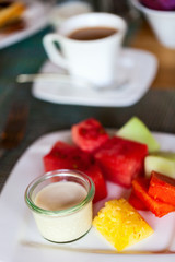 Breakfast with fresh fruits and yoghurt