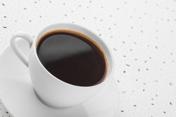 Cup of coffee on spotty background