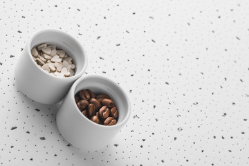 Set of saucers filled with coffee beans and sweet candy