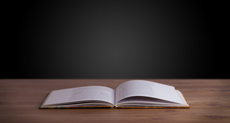 Open book on wooden deck