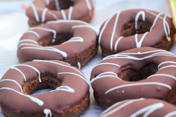 A lot of tasty chocolate donuts