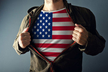 Man stretching jacket to reveal shirt with USA flag