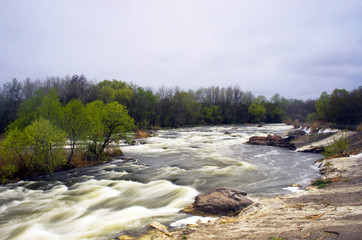 Threshold of the mountain river and wet stones