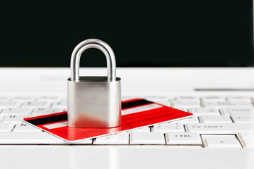 Credit Card and padlock on keyboard - security.