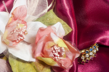  wedding rings on colorful fabric