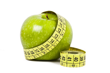 apple and measuring tape isolated on white background