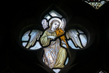 Angel playing lyre, stained glass