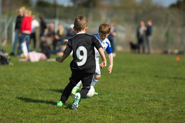 Two boys playing soccer