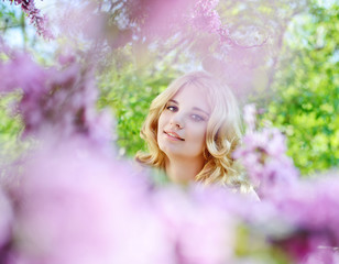 girl in spring flowers garden