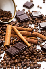 Coffee beans, cinnamon stick and chocolate