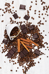 Coffee beans, cinnamon stick and chocolate