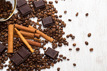 Coffee beans, cinnamon stick and chocolate