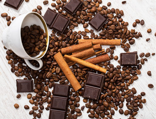 Coffee beans, cinnamon stick and chocolate