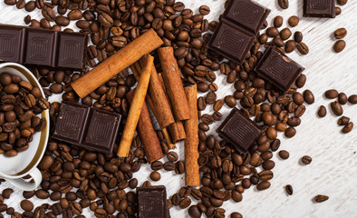 Coffee beans, cinnamon stick and chocolate
