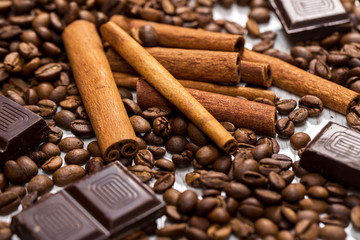 Coffee beans, cinnamon stick and chocolate