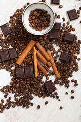 Coffee beans, cinnamon stick and chocolate