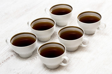 Cups with tea or coffee