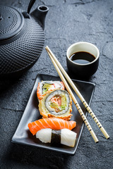 Fresh sushi served in with tea