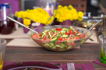 Closeup of plate with salad on decorated table