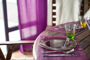 Closeup of beautiful color tableware for decorated table