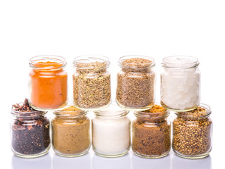 Different variety of sugar and spices over white background