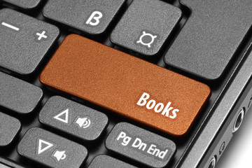 Books. Orange hot key on computer keyboard