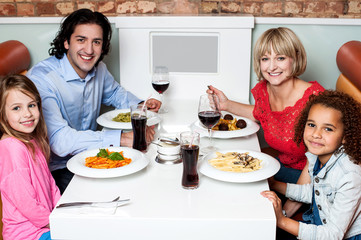 Happy family together in a restaurant