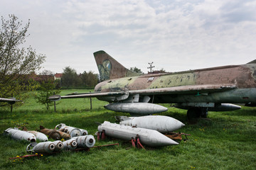 Old fighter plane with a variety of bombs