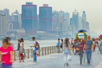 Obraz premium People blurred in motion on the street walking