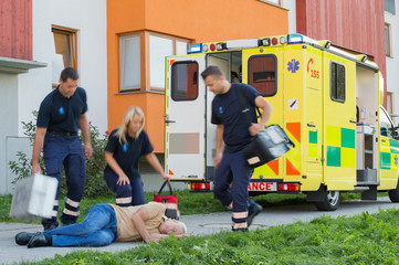 Paramedical team arriving to unconscious elderly man © CandyBox Images