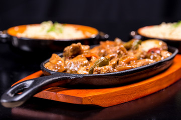 Pork in black bean souse with green pepper and onion