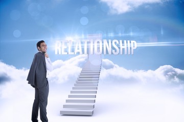 Relationship against shut door at top of stairs in the sky