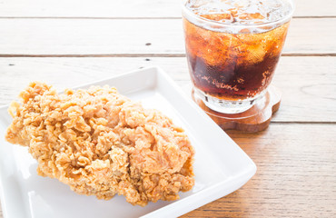 Close up fried chicken with cola drink