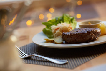 steak with sauce and vegetables