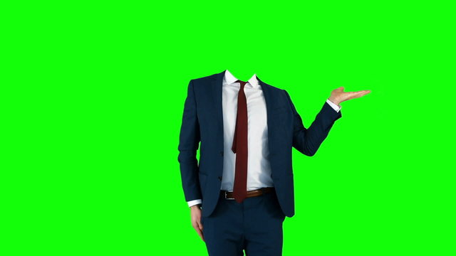 Headless businessman gesturing to camera