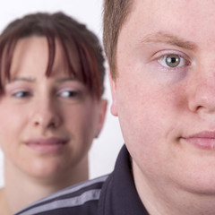 Man is being watched by wife