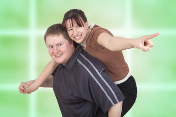 Obraz premium Man carrying woman piggyback