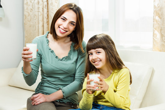 Glass of milk for mother and daughter