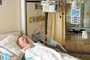Senior man in hospital bed