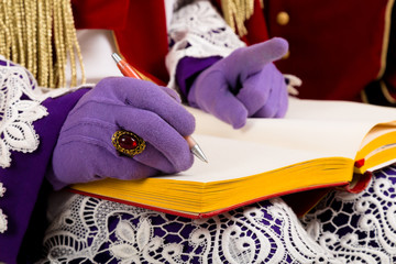 hands of sinterklaas with book