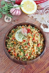 Quinoa salad with vegetables,lemon and thyme.