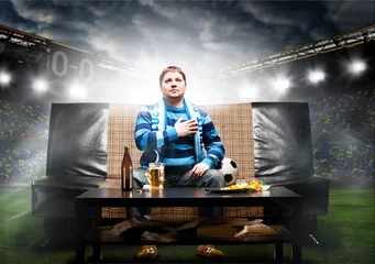 Fototapete Fußball soccer fan on sofa