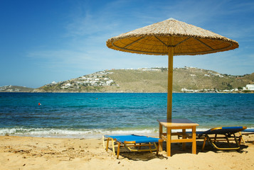 Sunbeds and umbrellas on Mykonos beach