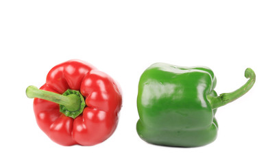 Two red and green peppers close up.