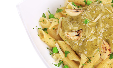 Pasta with pesto sauce. Close up.