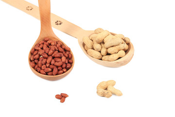 Wooden spoons with peanuts.