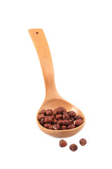 Wooden spoon with nuts.