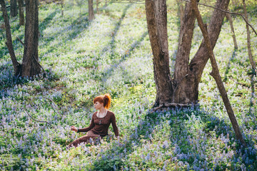 Beautiful young woman in the forest