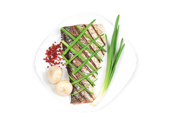 Grilled fish with vegetables.