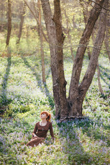 Fototapeta na wymiar Beautiful young woman in the forest